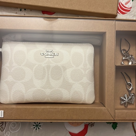 Coach Handbags - Coach wristlet with charms